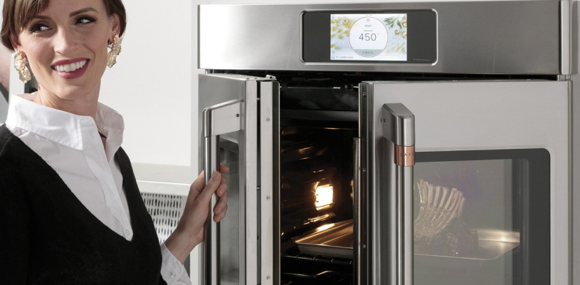 lady opening wall oven